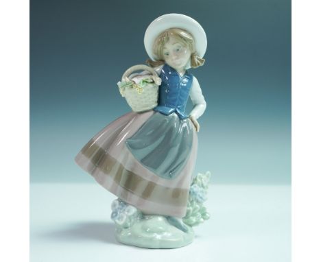 Lladro porcelain figurine Sweet Scent (model 5221), sculpted by Jose Puche and issued in 1984. This charming piece depicts a 