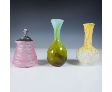A beautifully curated collection of three art glass pieces, each highlighting distinct craftsmanship and artistic detailing. 