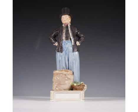 A finely detailed Royal Copenhagen porcelain figurine depicting a Danish market vendor standing confidently beside a sack and