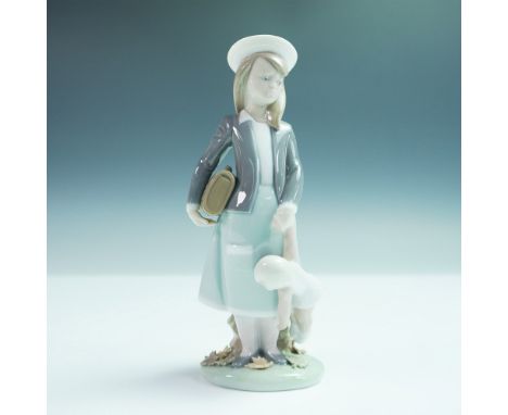 Charming Lladro porcelain figurine titled Autumn, model number 1005218. Sculpted by Juan Huerta and issued in 1984, this hear