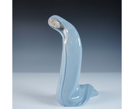 This Lladro figurine, titled Madonna (#1004534), features a serene depiction of the Virgin Mary, draped in a flowing blue man