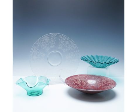 A captivating collection of art glass and crystal decorative bowls and plates, each showcasing distinct artistry and craftsma