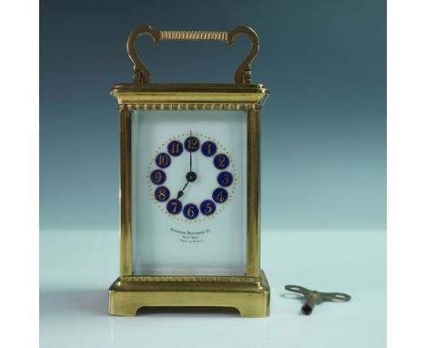 A finely crafted antique French brass carriage clock retailed by Ovington Brothers Co., New York. This elegant timepiece feat