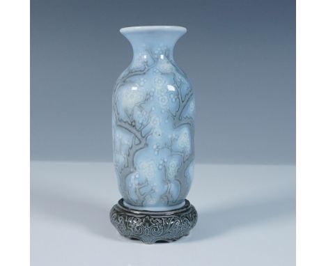 This Lladro Little Vase Blue (#1001220) features an elegant cherry blossom motif in soft blue and white tones, showcasing int
