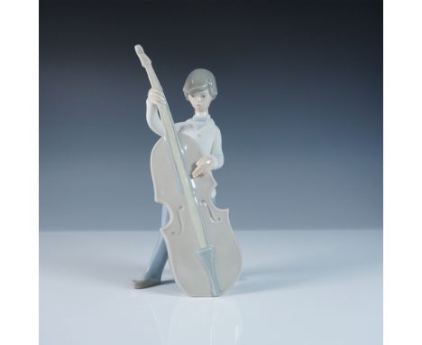 A finely crafted Lladro porcelain figurine titled Boy with Double Bass, sculpted by Juan Huerta. This charming piece captures