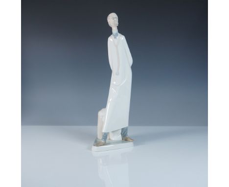 This Lladro porcelain figurine, item #1004602, depicts a distinguished doctor standing in a contemplative pose, representing 