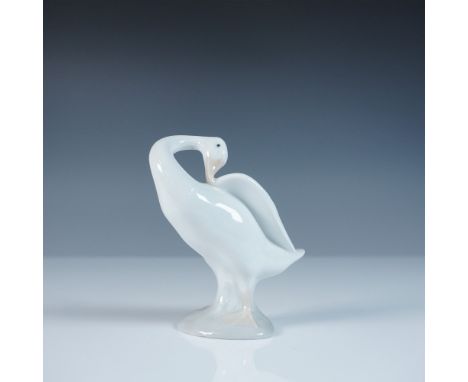 A delightful addition to any collection, this Lladro porcelain figurine, Little Duck (model 1004553), showcases the brand’s e
