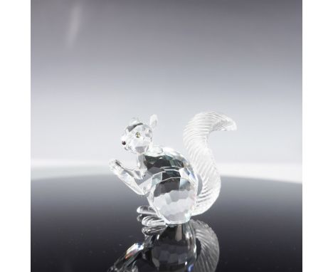 Clear crystal squirrel with amber eyes, black nose and frosted, grooved tail. Swarovski swan backstamp. This item has its ori