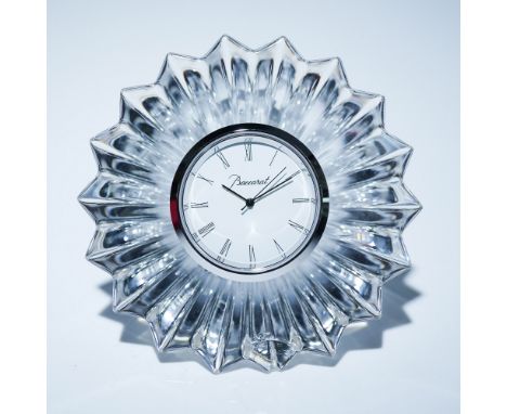 Exquisite Baccarat Mille Nuits crystal clock designed by Mathias, featuring a radiant sunburst motif with finely cut facets t