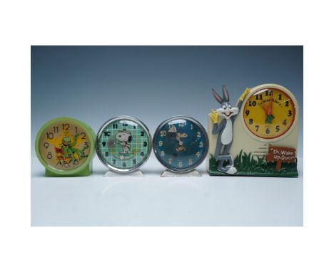 This lot includes four vintage character alarm clocks featuring beloved cartoon icons. Included are a Timex Kermit the Frog c