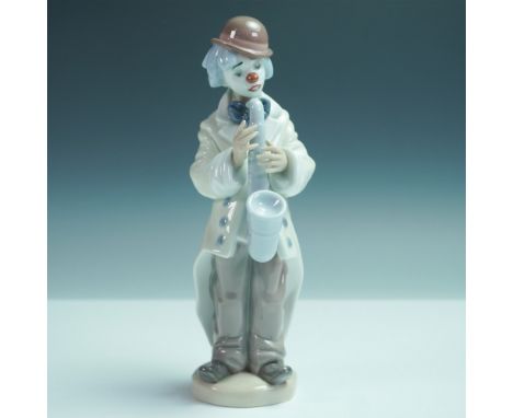 Charming Lladro porcelain figurine titled Sad Sax (Item #5471), depicting a whimsical clown playing a saxophone. This finely 