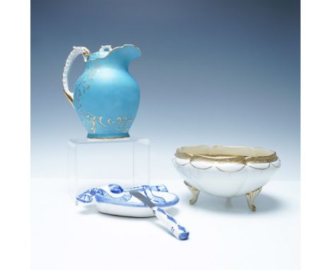 A refined collection of vintage hand-painted porcelain and faience, showcasing exquisite craftsmanship. Included is a blue po