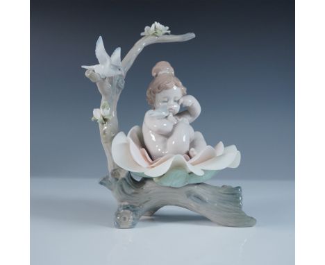 A celebration of renewal and innocence, this Lladro porcelain figurine Born in Springtime beautifully captures the delicate c