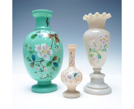 A stunning trio of hand-painted opaline glass vases, each adorned with intricate floral designs. This set features a variety 