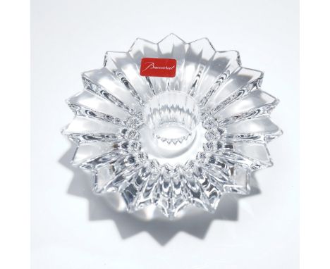Brilliantly crafted in fine French crystal, this Baccarat candle holder showcases a radiating starburst design that captures 