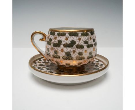 Exquisite Japanese Kutani porcelain cup and saucer set, featuring a mesmerizing hand-painted floral motif in a harmonious pal