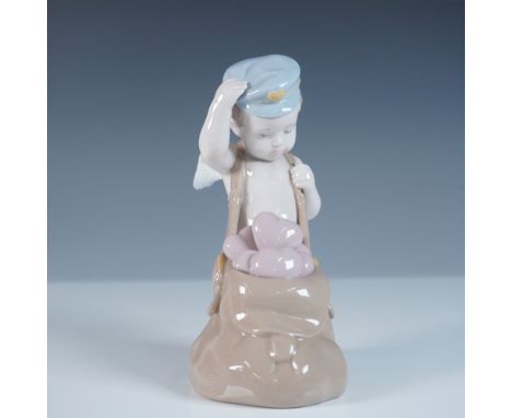 Lladro Love Letters, model 01006830, also known as Repartiendo Amor, is a beautifully sculpted porcelain figurine designed by