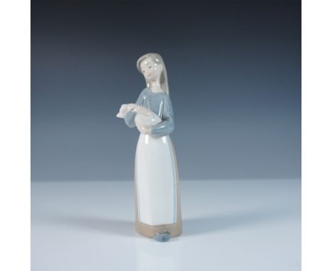Capturing a heartwarming moment, this Lladro porcelain figurine, Girl with Pig (model 1001011), showcases the delicate artist