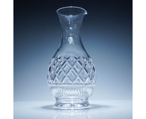Clear lead crystal carafe featuring a combination of criss-cross and vertical cut patterns. The design includes a flared rim 
