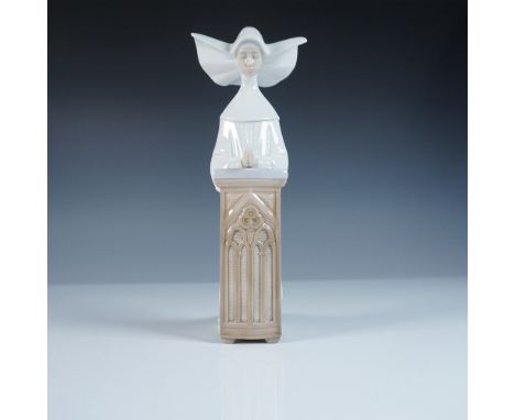 This Lladro figurine, titled Meditation (#1005502), portrays a serene nun in a traditional habit, seated in deep contemplatio