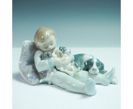 A charming Lladro porcelain figurine titled Sweet Dreams, model number 01001535. Designed with intricate detailing, this piec