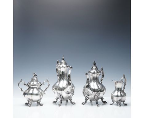 American silverplate Coffee pot, Tea pot, sugar bowl with cover and creamer all designed with flowers and scrolls. Each piece