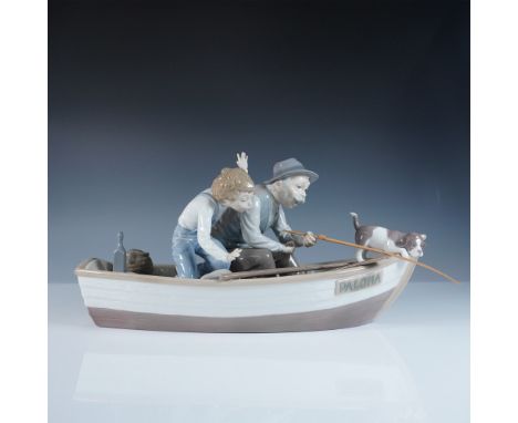 This Lladro figurine, titled Fishing with Gramps (#1005215), portrays a heartwarming scene of a grandfather and grandson enjo