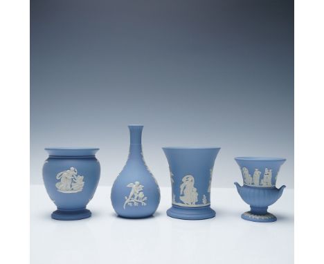 A collection of four Wedgwood blue Jasperware vases, each adorned with classical white relief decorations depicting mythologi