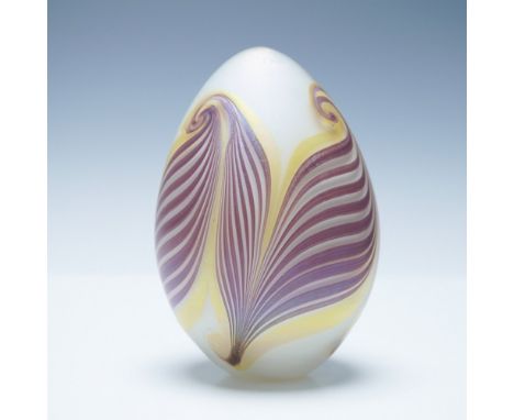 This stunning UMGS art glass paperweight features a mesmerizing swirl design in rich shades of purple, gold, and cream. The p