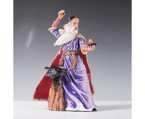 This hand-painted porcelain figure portrays a powerful sorcerer in a striking pose, wearing a flowing purple robe with yellow