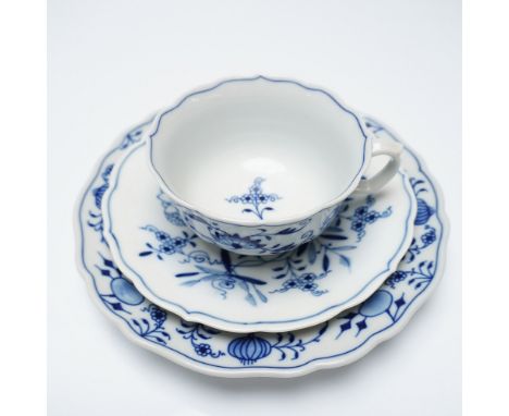 A fine Meissen porcelain trio in the iconic Blue Onion (Zwiebelmuster) pattern, featuring a teacup, saucer, and dessert plate