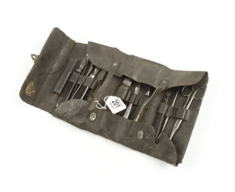 A French veterinary kit of tools in leather roll marked GRAILOT G