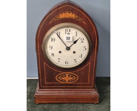 A 20th century mahogany lancet cased mantle clock, the movement chiming on three rods, the enamel dial with Arabic numerals, 