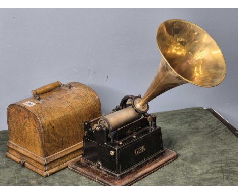An Edison Gem phonograph to play cylinder discs and contained in an oak veneered case 