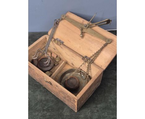 A boxed Carnegie and Layton brass balance scales with some weights