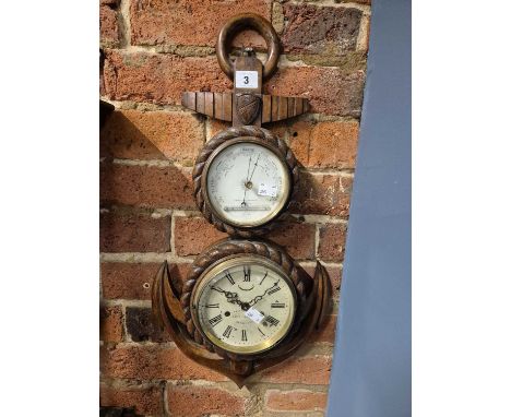 A mahogany ship's anchor cased, holosteric barometer and battery powered clock, the former with a mercury thermometer at the 