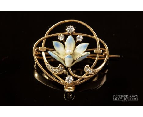 An Art Nouveau 15 carat gold, pearl, diamond and enamel brooch/pendant, c1900, the stylised iridescent enamel lily with natur