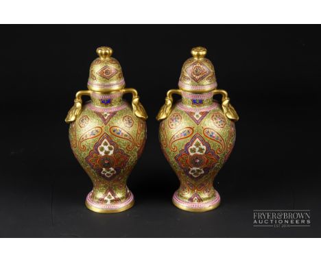 A pair of rare Ottoman market Coalport vases &amp; covers, baluster form with lotus leaf and bud handles &amp; finial, decora