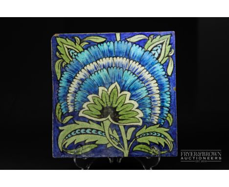 A large William de Morgan tile, fan pattern in blue and green, impressed Merton Abbey mark