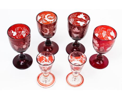 Four Bohemian ruby flash wine glasses, cut through to clear with fruiting vines; and two liqueur glasses with painted flash d