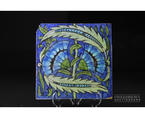 A large William de Morgan tile, fan pattern in blue and green, impressed Merton Abbey Mark