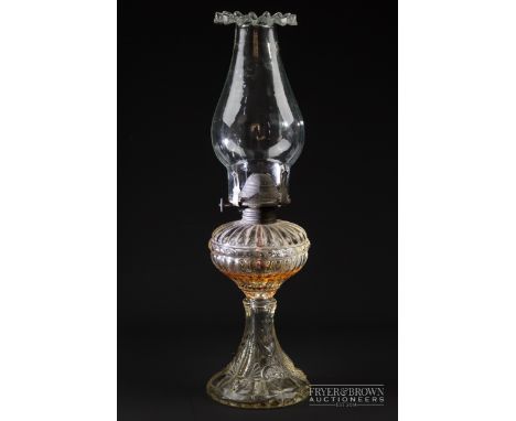 A Victorian moulded glass oil lamp with original funnel