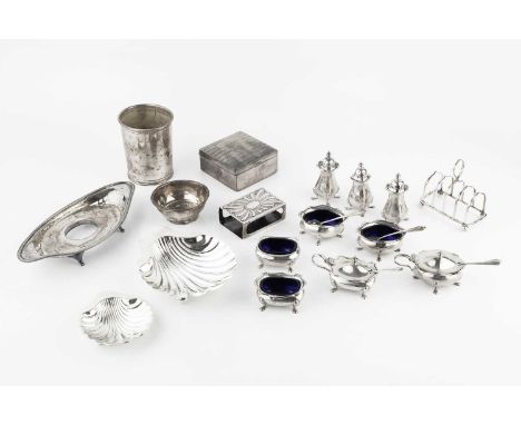 A collection of silver, comprising an American beaker by Reed &amp; Barton, stamped sterling, 9.5cm high, two butter shells, 