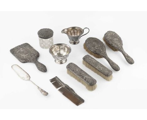 A silver milk jug and sugar basin, with panelled decoration, by Viner's, Sheffield 1933, 8.5oz, and a silver backed dressing 