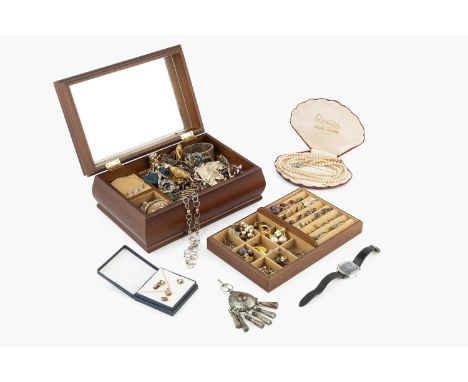 A large quantity of assorted costume jewellery, to include a hinged silver bangle, an oval shell cameo brooch, miscellaneous 