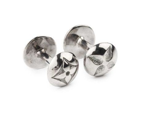 A pair of silver cufflinks by Louis Vuitton, of curved form, the rounded ends with flowerhead and LV logo decoration