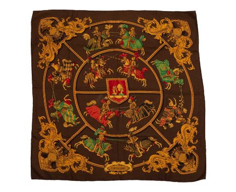A ‘Chevalerie’ silk scarf by Hermès, designed by Cathy Latham, depicting jousting knights and two ladies to the centre watchi