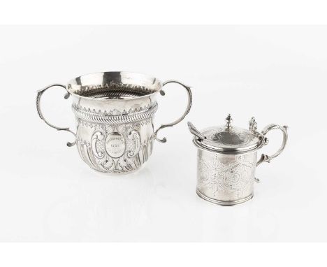 A late Victorian silver twin handled porringer, with girdled, lobed and embossed decoration by Samuel Walton Smith, London 18