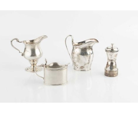 A silver pepper grinder, of waisted form, by Hukin &amp; Heath, Birmingham 1937, 10.5cm high, a silver cream jug of baluster 