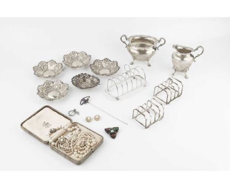 An Edwardian Scottish silver twin handled sucrier, and matching milk jug, Glasgow 1904, a pair of silver five bar toast racks